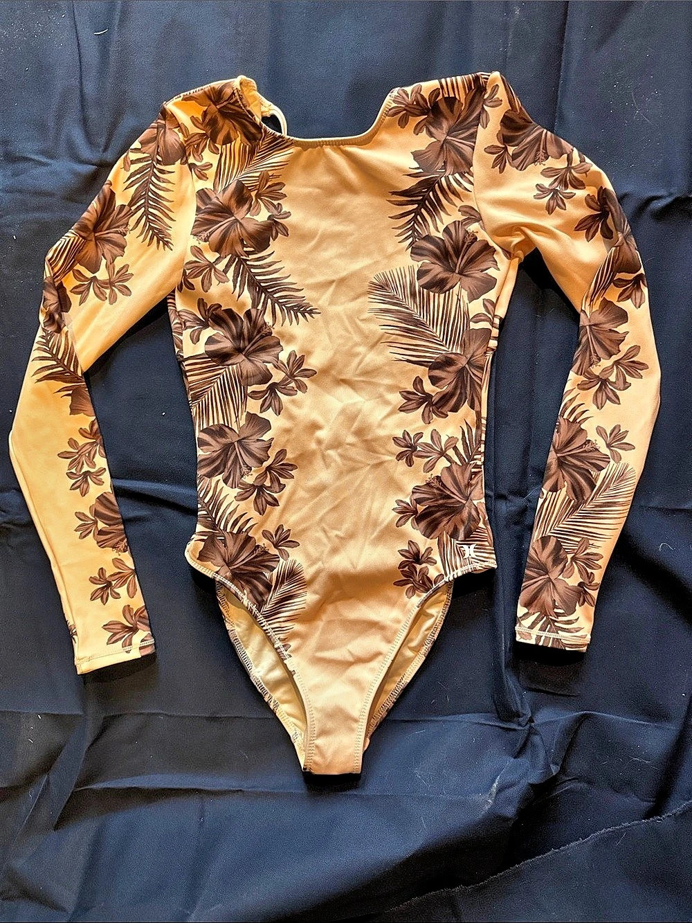 Hurley Floral Long Sleeve One Piece in Orange & Brown Like New